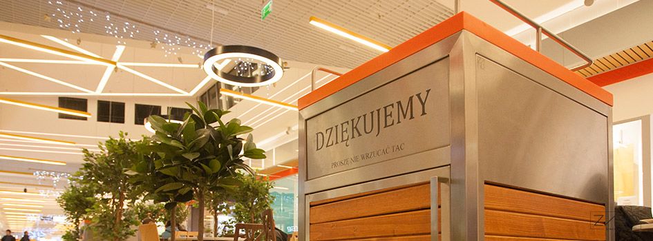 Salver basket in food court space with etched lettering